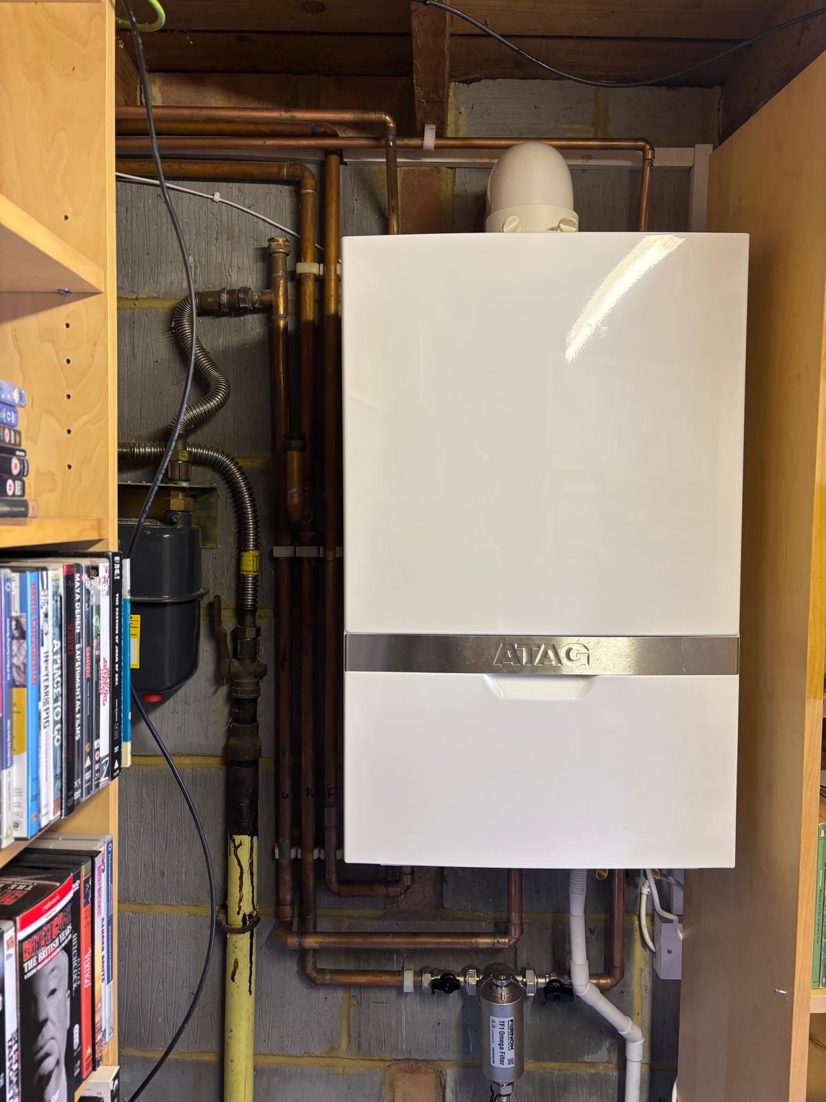ATAG boiler installed with neat copper pipework in a home utility space